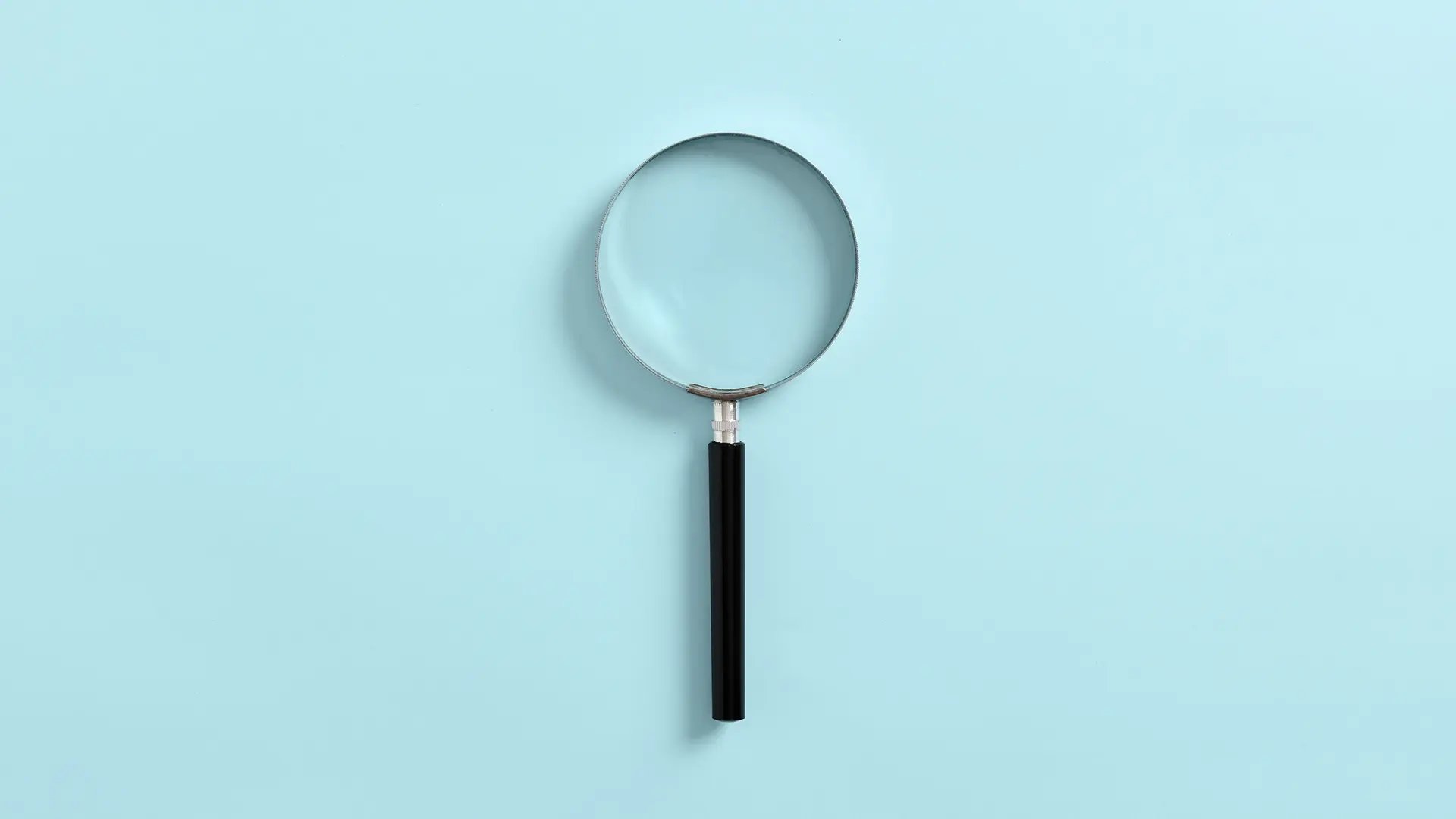 Magnifying glass on blue backgrond